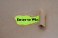 Enter to win word written under torn paper Royalty Free Stock Photo