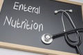 Enteral nutrition written on a blackboard, conceptual image Royalty Free Stock Photo