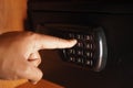 Entering a code on a safe in a modern setting Royalty Free Stock Photo