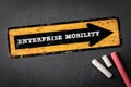 Enterprise Mobility. Yellow directional arrow with text on a dark chalkboard background