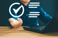 Enterprise performance checklist. Men use computers to do online checklist surveys and fill in digital checklists