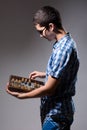 Enterprising young man with an abacus. Royalty Free Stock Photo