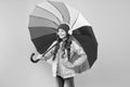 Entertain yourself. Fun concept. Feeling good. Girl having fun walking wireless headphones under colorful umbrella. Fall Royalty Free Stock Photo