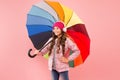 Entertain yourself. Fun concept. Feeling good. Girl having fun walking wireless headphones under colorful umbrella. Fall Royalty Free Stock Photo