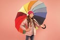 Entertain yourself. Fun concept. Feeling good. Girl having fun walking wireless headphones under colorful umbrella. Fall Royalty Free Stock Photo