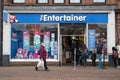 The Entertainer Toy Shop front and entrance with people socially distancing and queuing to enter the shop.  High Street Royalty Free Stock Photo