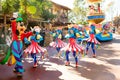 Entertainers in colorful costumes participating in DisneyWorld parade