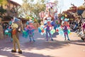 Entertainers in colorful costumes participating in DisneyWorld parade