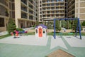 Entertainment area.kids playhouse in the entertainment center. Plastic children play house . Childs swing in a park .Plastic and