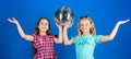 Entertainment concept. Sisters friends with disco ball. Lets start party. Cheerful kids hold disco ball. Disco dances