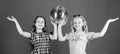 Entertainment concept. Sisters friends with disco ball. Lets start party. Cheerful kids hold disco ball. Disco dances