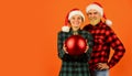 Entertainment ideas for adults. Santa team. Loving couple orange background. Christmas magical time. We love christmas Royalty Free Stock Photo