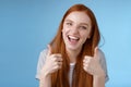 Enthusiastic amused outgoing redhead beautiful girl say yeah supportive like awesome idea show thumbs-up approval
