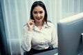 Enthusiastic asian call center with headset on her workplace portrait. Royalty Free Stock Photo