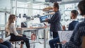 Enthusiastic Black Female Chief Engineer Explains to Computer Scientists and Developers Principles