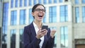 Enthusiastic business woman showing success gesture reading mobile email, career Royalty Free Stock Photo