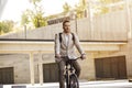 Excited man riding a bicycle stock photo