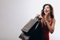 Enthusiastic Chic Shopping Girl With Bags of Purchases is Pleasantly Surprised