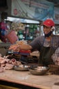 Jakarta, Indonesia - June 20, 2020: An enthusiastic chicken seller