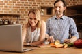 Enthusiastic committed couple following the recipe