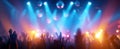 The Enthusiastic Crowd Celebrating Under Colorful Lights at a Concert Event.AI generated image Royalty Free Stock Photo