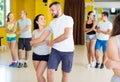 Enthusiastic dancing couples learning salsa Royalty Free Stock Photo