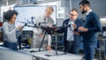 Enthusiastic Diverse Engineers Have Energetic Discussion About Remote Control Drone Design
