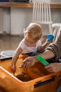 Enthusiastic family playing home kinetic sandbox use wooden ecological toys enjoying leisure