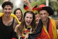 Enthusiastic German sport soccer fans celebrating victory.