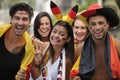 Enthusiastic German sport soccer fans celebrating victory.