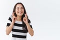 Enthusiastic, hopeful young girl keep faith, feeling lucky and amused as awaiting something important, begging for good Royalty Free Stock Photo