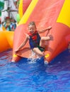 Enthusiastic kid on slide