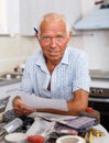 Enthusiastic man making list of repair works Royalty Free Stock Photo