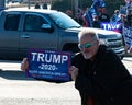 Enthusiastic man and Trump supporter shows his sign to passing vehicles Royalty Free Stock Photo