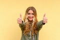 Enthusiastic motivated woman giving a thumbs up Royalty Free Stock Photo