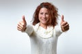 Enthusiastic motivated woman giving a thumbs up Royalty Free Stock Photo