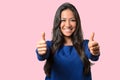 Enthusiastic motivated woman giving a thumbs up Royalty Free Stock Photo