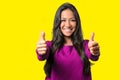 Enthusiastic motivated woman giving a thumbs up Royalty Free Stock Photo