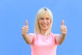 Enthusiastic motivated woman giving a thumbs up Royalty Free Stock Photo