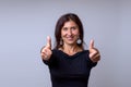 Enthusiastic motivated woman giving a thumbs up Royalty Free Stock Photo