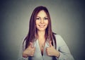 Enthusiastic motivated woman giving a thumbs up gesture of approval Royalty Free Stock Photo