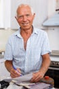 Enthusiastic man making list of repair works Royalty Free Stock Photo