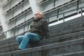 An enthusiastic pensioner. The older man sits and enjoys the silence. Comfortable relaxation and tranquility Royalty Free Stock Photo