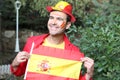 Enthusiastic Spanish man waving the national flag Royalty Free Stock Photo