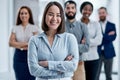 With an enthusiastic team, you can achieve almost anything. Portrait of a businesswoman standing in an office with her