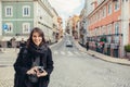 Enthusiastic traveler woman walking streets of european capital.Tourist in Lisbon,Portugal