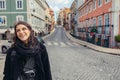 Enthusiastic traveler woman walking streets of european capital.Tourist in Lisbon,Portugal