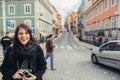 Enthusiastic traveler woman walking streets of european capital.Tourist in Lisbon,Portugal