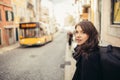 Enthusiastic traveler woman walking streets of european capital.Tourist in Lisbon,Portugal