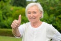 Enthusiastic 82 year old woman giving a thumbs up Royalty Free Stock Photo